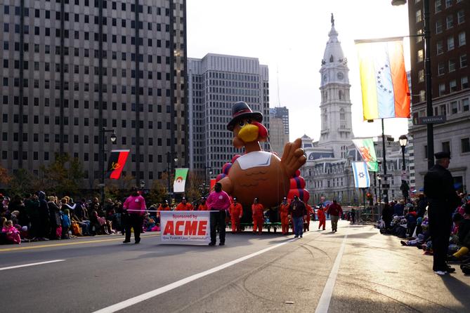 Handlers walk the turkey balloon down the Benjamin Franklin Parkway in Philadelphia during the Thanksgiving Day Parade.