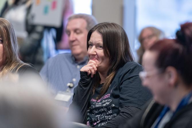 Erika Shambaugh and other audience members listen during a “Voices of the Epidemic” forum hosted by Spotlight PA in April 2025 in Berks County.