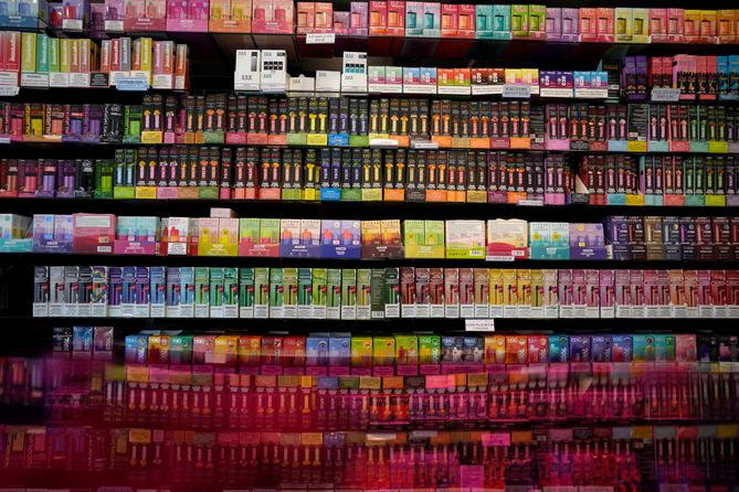 Disposable flavored electronic cigarette devices are displayed for sale at Vapes N Smoke in Pinecrest, Fla., Monday, June 26, 2023.