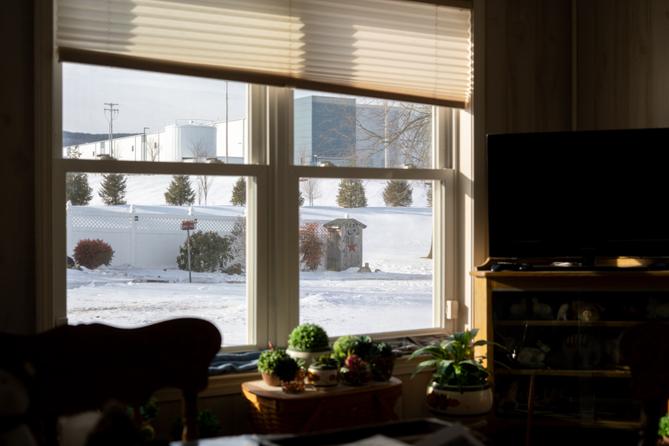 Through her back window, Debra Fisher can see the warehouse the Trump administration bought for an ICE detention center.