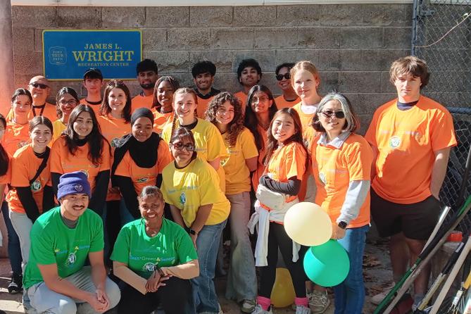 Gweny Love poses with volunteers from a neighborhood cleanup Gweny Love poses with volunteers from a neighborhood cleanup