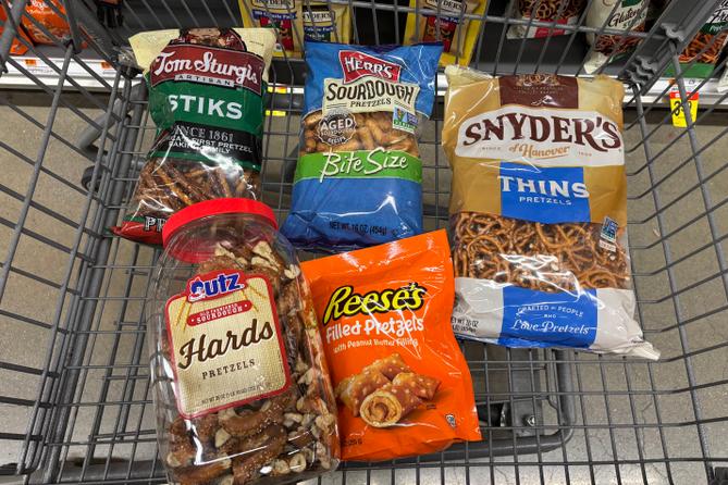 Assorted pretzel varieties placed in a shopping cart at Acme