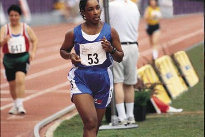 Loretta Claiborne runs during the 1999 Special Olympics World Summer Games in North Carolina.