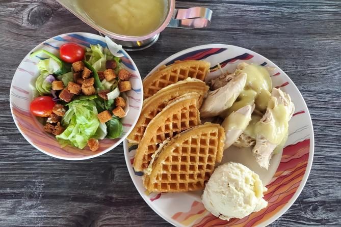 Chicken and waffles, and a salad. Chicken and waffles, and a salad.