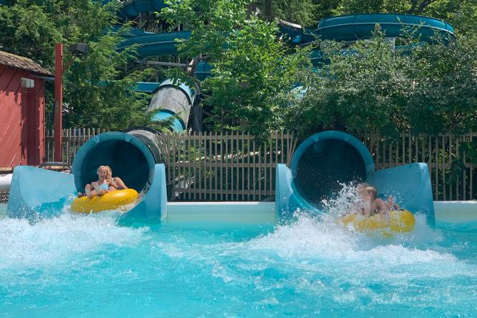 Knoebels patrons plunge into a pool from a water slide Knoebels patrons plunge into a pool from a water slide
