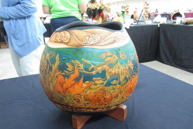 A dried gourd decorated with underwater scenery. A dried gourd decorated with underwater scenery.