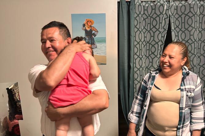 Erasmo Zavala hugs his granddaughter, Selene, as his wife Maria stands nearby. A picture of Selene’s mother, Selena, who was murdered, hangs behind the family. May 29, 2026. Erasmo Zavala hugs his granddaughter, Selene, as his wife Maria stands nearby. A picture of Selene’s mother, Selena, who was murdered, hangs behind the family. May 29, 2026.