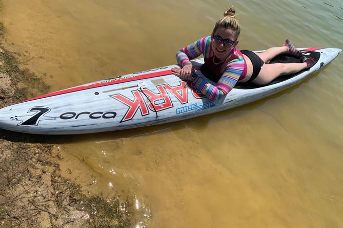 Amanda Parezo rides a paddleboard