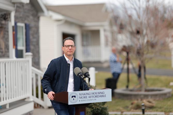 Gov. Josh Shapiro stands behind a podium that says “Making Housing More Affordable.” Gov. Josh Shapiro stands behind a podium that says “Making Housing More Affordable.”