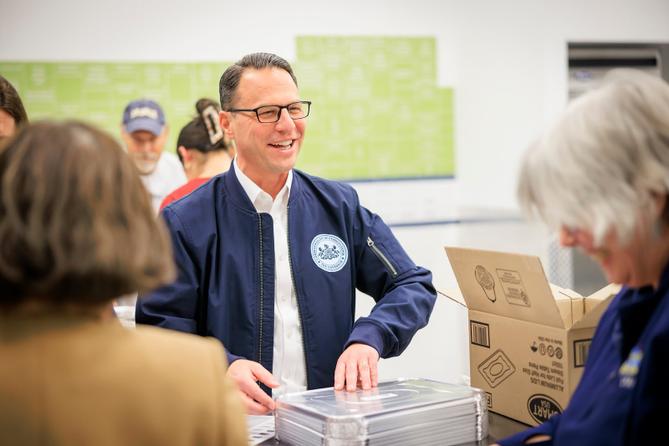 Gov. Josh Shapiro volunteered to package meals at MANNA (Metropolitan Area Neighborhood Nutrition Alliance) ahead of the Thanksgiving holiday