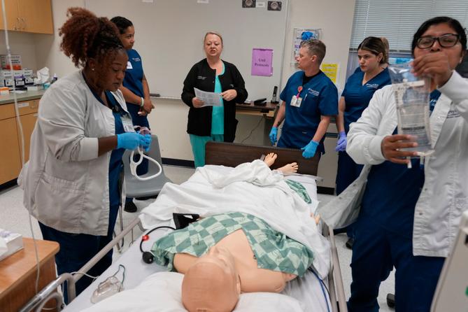 Instructor Renee McFatridge, center back, directs nursing students in the simulation lab at Forsyth Technical Community College in Winston-Salem, N.C., Thursday, Aug. 20, 2026 Instructor Renee McFatridge, center back, directs nursing students in the simulation lab at Forsyth Technical Community College in Winston-Salem, N.C., Thursday, Aug. 20, 2026