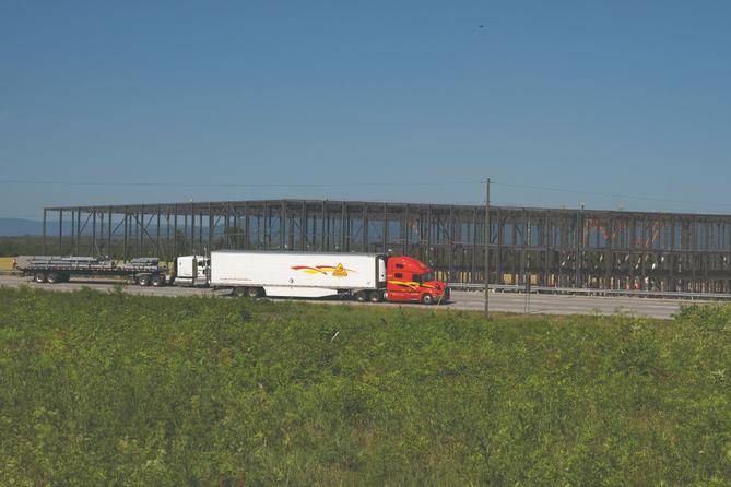 A large warehouse rises along Interstate 81 near Greencastle, PA, in 2021.