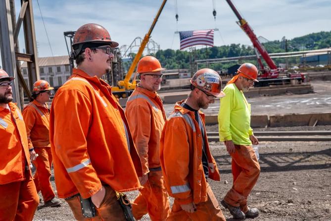 U.S. Steel employees walk to greet company and government officials at the announcement of up to $2.5 billion in investment into upgrades at the Mon Valley Works on Monday, June 8, 2026, at Edgar Thomson Plant in Braddock.