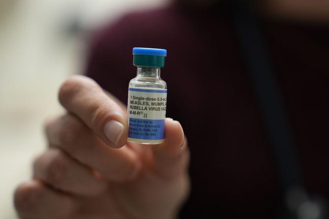 Dr. Jessica Early holds a vial of the combination measles, mumps and rubella vaccine at Prisma Health Pediatrics in Greer, S.C., March 18, 2026. Dr. Jessica Early holds a vial of the combination measles, mumps and rubella vaccine at Prisma Health Pediatrics in Greer, S.C., March 18, 2026.