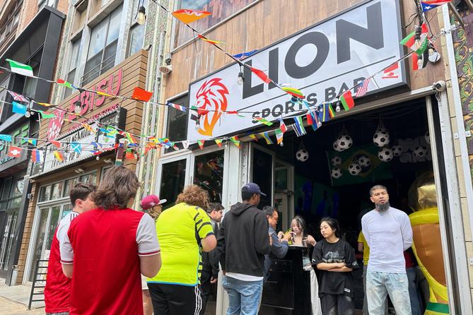 Fans arrive to watch a Champion league soccer match between Arsenal and Paris Saint-Germain at the Lion Sports Bar, in Philadelphia. Fans arrive to watch a Champion league soccer match between Arsenal and Paris Saint-Germain at the Lion Sports Bar, in Philadelphia.
