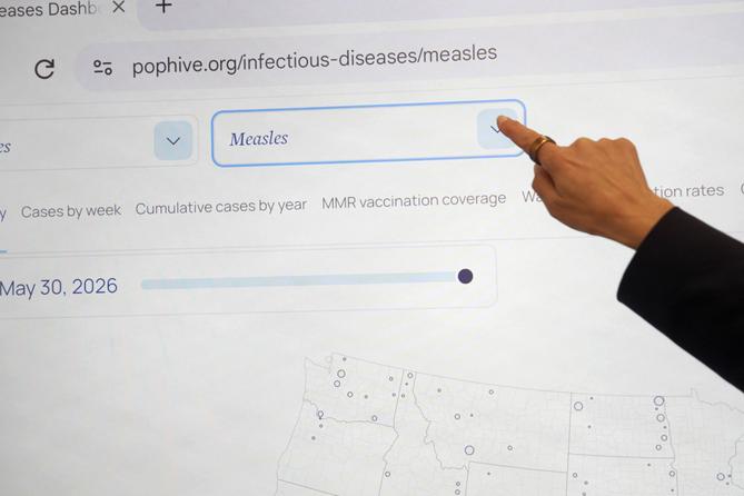 Georgetown University's Rebecca Katz points to measles data for the country at Georgetown's Health Security Operations Center in Washington on June 3, 2026. Georgetown University's Rebecca Katz points to measles data for the country at Georgetown's Health Security Operations Center in Washington on June 3, 2026.