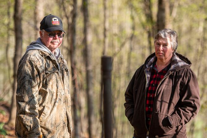 Cheryl and Joe Thomas with one of the dozens of abandoned wells on their Duke Center, Pa. property.