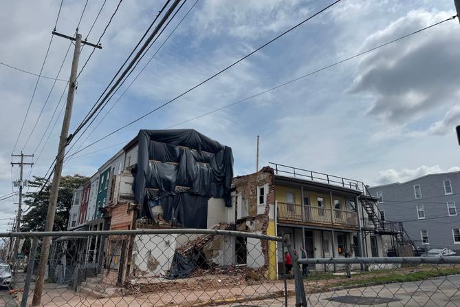 The three-story apartment complex at 501 North 8th St. in Reading remained fenced off July 18 after the south wall collapsed.