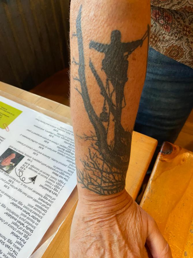Cyndi Compton shows a tattoo she has in memory of her son Isaiah.